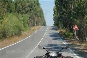 When riding a motorcycle, should the rider wear protective glasses?