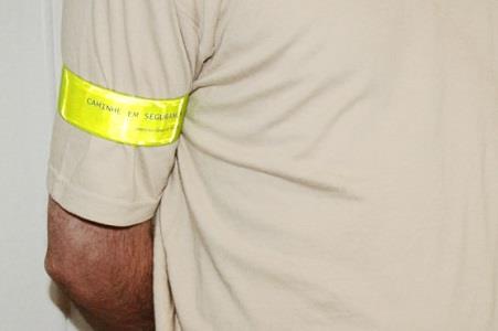 To increase his visibility, a motorcycle rider should preferably wear: