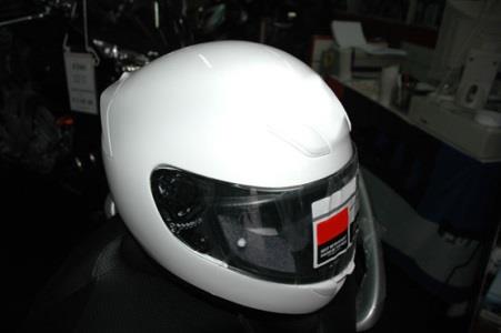 While riding, the motorcyclist is required to use: