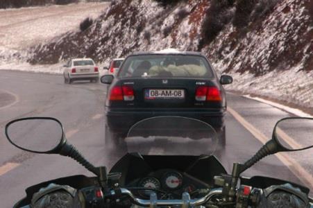 The rider of a motorcycle should know that when riding on a wet or slippery surface the braking distance decreases. Do you agree with this statement?
