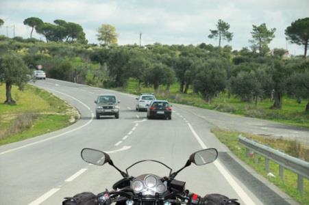 On a motorcycle, the braking distance can vary due to: