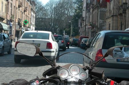 Riding on this type of road, with urban characteristics and heavy traffic, requires the rider to recognise that: